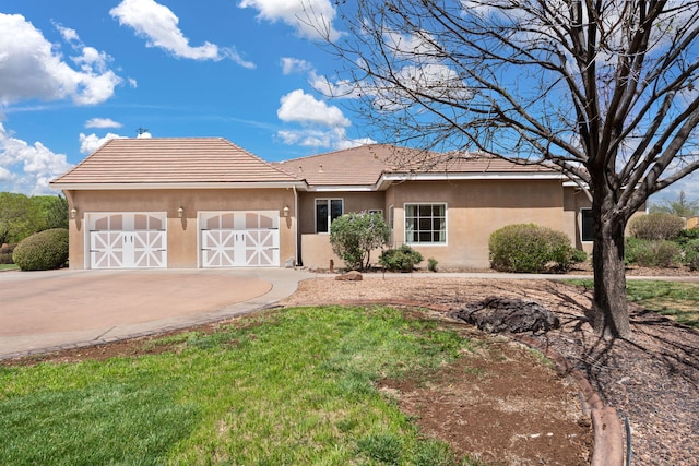 ranch-style house with an attached garage, a tile roof, driveway, and stucco siding