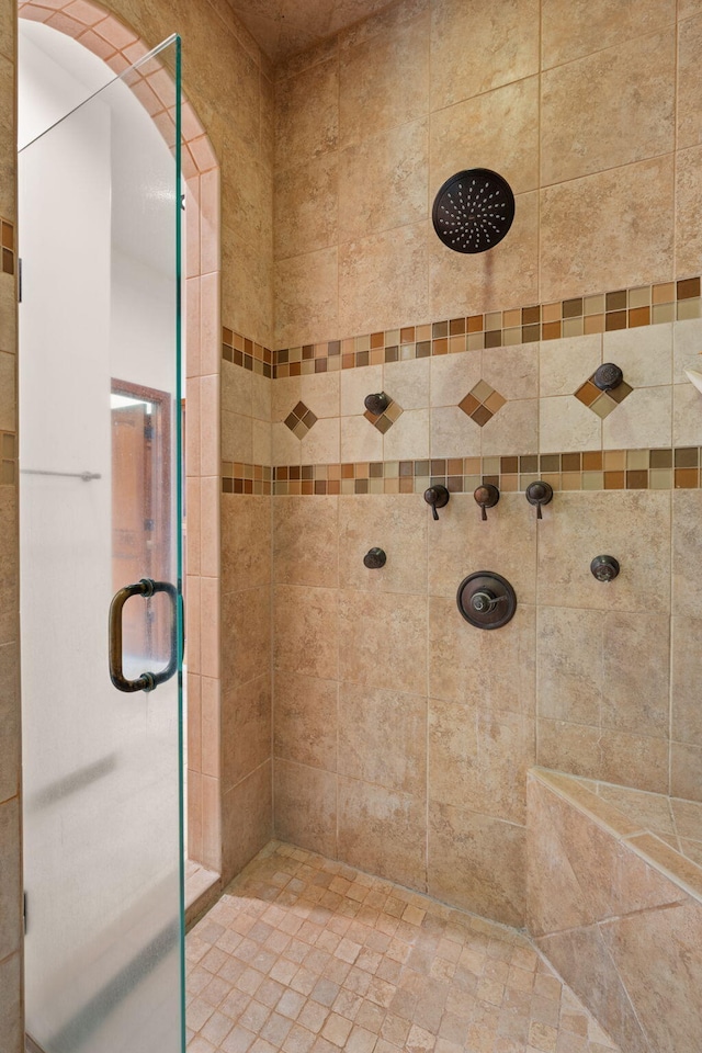 bathroom with a shower stall