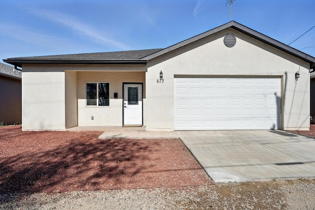 ranch-style house with a garage, a shingled roof, stucco siding, and concrete driveway