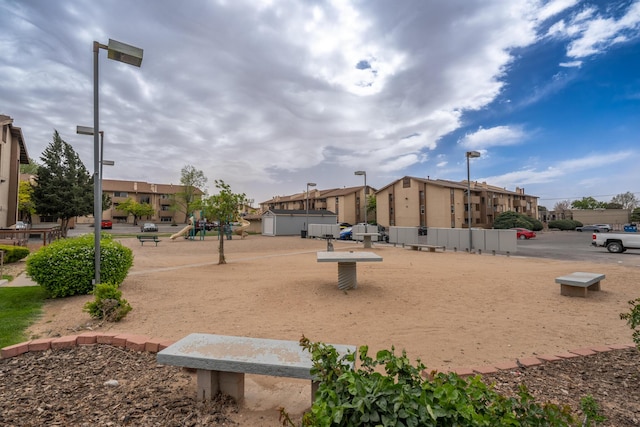 view of property's community with playground community and a residential view