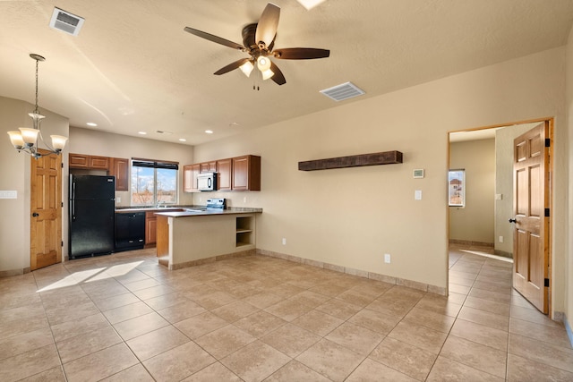 5720 Rio Lama Rd NE, Rio Rancho, NM 87144 - kitchen featuring visible vents, black appliances, a peninsula, and light tile patterned flooring
