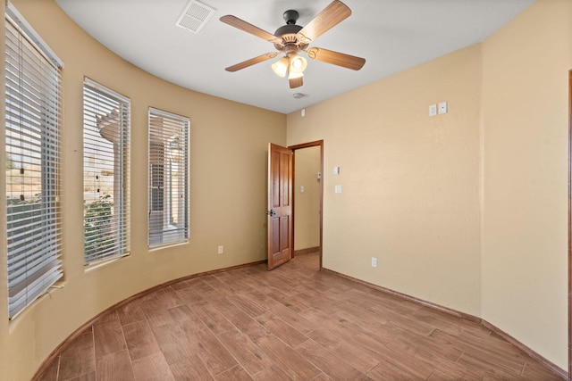 5720 Rio Lama Rd NE, Rio Rancho, NM 87144 - spare room with visible vents, light wood-type flooring, ceiling fan, and baseboards