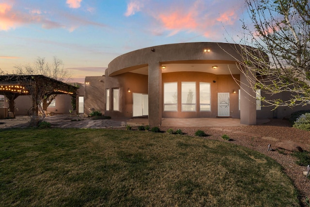 5720 Rio Lama Rd NE, Rio Rancho, NM 87144 - view of front of house with a patio, a gazebo, a front lawn, and stucco siding