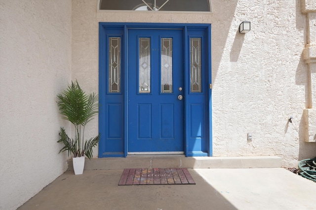 10516 Calle Sombra NW, Albuquerque, NM 87114 - property entrance with stucco siding
