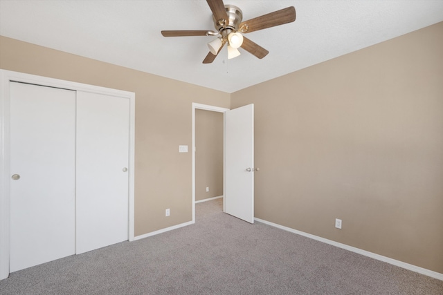 10516 Calle Sombra NW, Albuquerque, NM 87114 - unfurnished bedroom featuring carpet, a closet, a ceiling fan, and baseboards