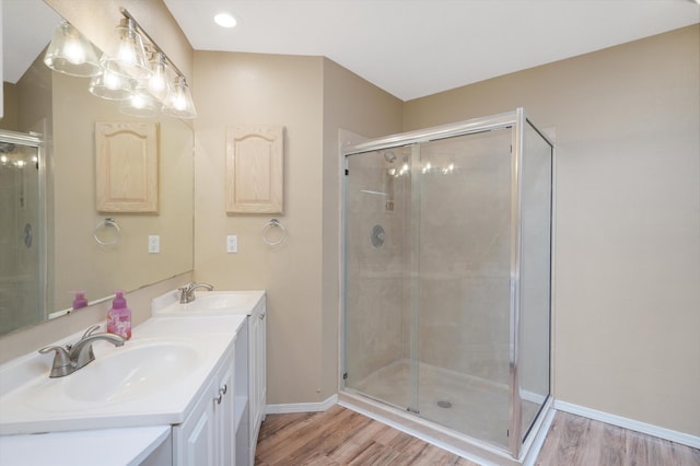 10516 Calle Sombra NW, Albuquerque, NM 87114 - bathroom featuring wood finished floors, baseboards, and a stall shower