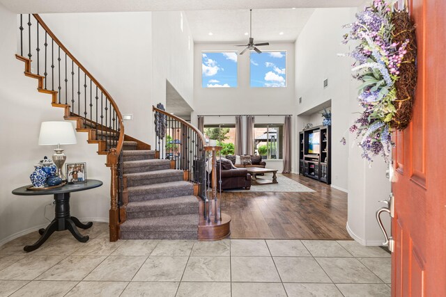 4024 Colina Roja Ln NE, Rio Rancho, NM 87124 - foyer entrance featuring stairs, ceiling fan, baseboards, a high ceiling, and recessed lighting
