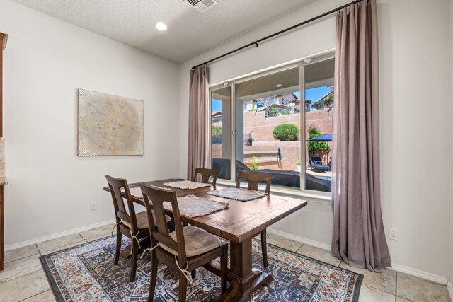 4024 Colina Roja Ln NE, Rio Rancho, NM 87124 - dining area featuring a textured ceiling and baseboards