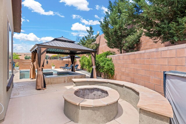 4024 Colina Roja Ln NE, Rio Rancho, NM 87124 - fenced backyard with a gazebo, an outdoor fire pit, a patio area, and an in-ground hot tub
