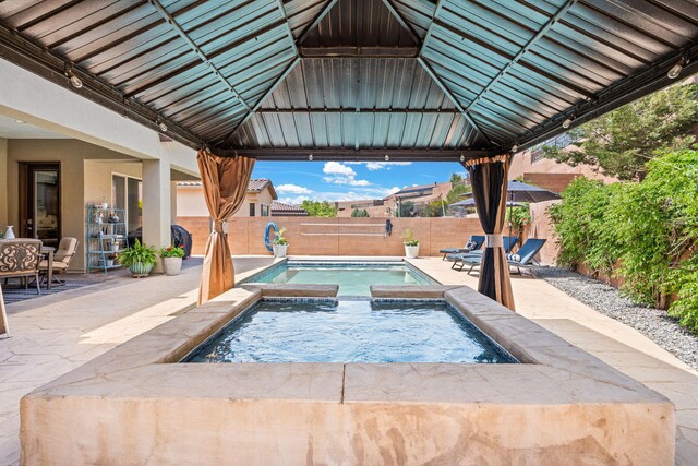 4024 Colina Roja Ln NE, Rio Rancho, NM 87124 - view of pool featuring a gazebo, an in-ground hot tub, a patio, and a fenced backyard