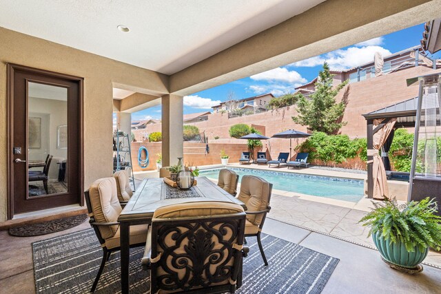 4024 Colina Roja Ln NE, Rio Rancho, NM 87124 - fenced backyard with a patio, a gazebo, and outdoor dining space
