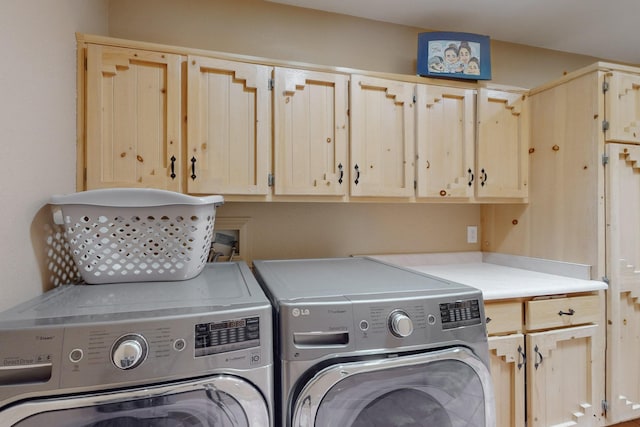 laundry room with cabinet space and washing machine and dryer