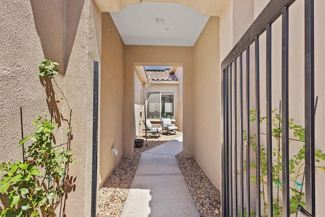 12209 Bear Valley Ln NW, Albuquerque, NM 87120 - view of exterior entry with a gate and stucco siding