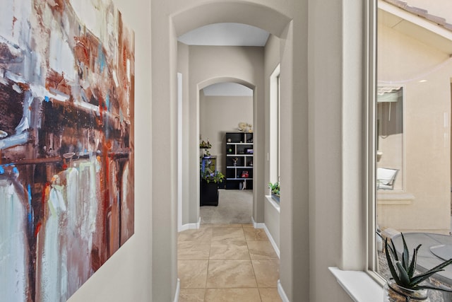 12209 Bear Valley Ln NW, Albuquerque, NM 87120 - hallway with marble finish floor, arched walkways, and baseboards