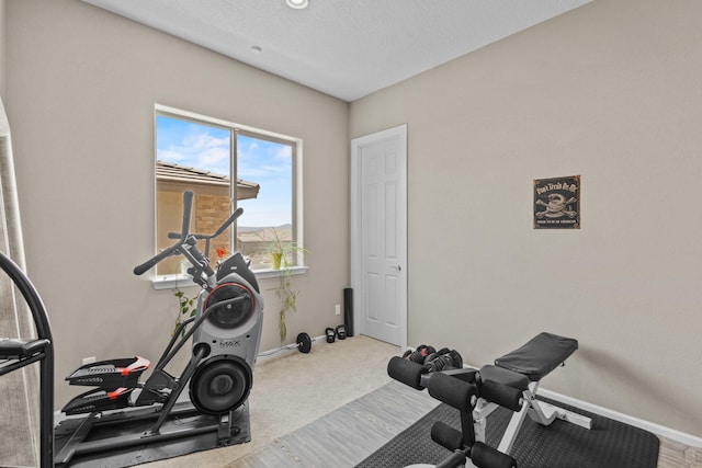 12209 Bear Valley Ln NW, Albuquerque, NM 87120 - exercise room with carpet and baseboards
