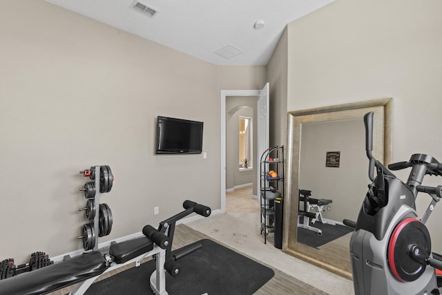 12209 Bear Valley Ln NW, Albuquerque, NM 87120 - exercise room with arched walkways, visible vents, and baseboards
