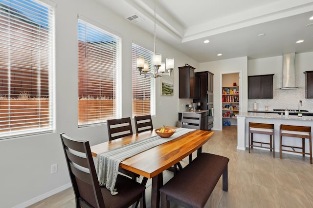 5002 Scope, Rio Rancho, NM 87144 - dining area with visible vents, recessed lighting, a healthy amount of sunlight, and an inviting chandelier