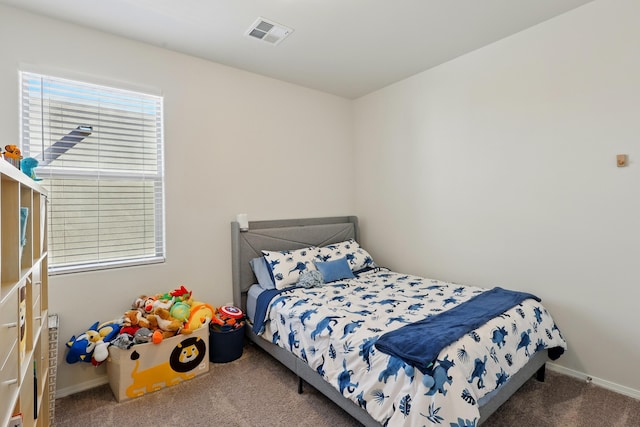 5002 Scope, Rio Rancho, NM 87144 - bedroom featuring baseboards, carpet, and visible vents