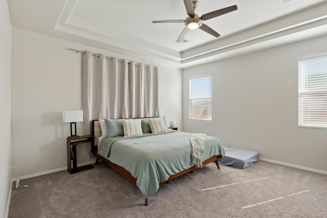 5002 Scope, Rio Rancho, NM 87144 - carpeted bedroom featuring a raised ceiling, baseboards, a ceiling fan, and visible vents