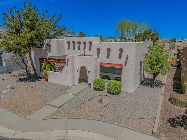 7417 Maplewood Dr NW, Albuquerque, NM 87120 - view of front of house with stucco siding and fence