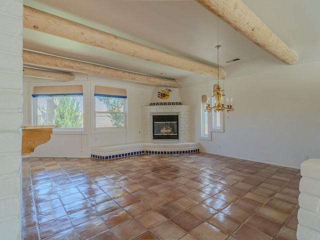 7417 Maplewood Dr NW, Albuquerque, NM 87120 - unfurnished living room featuring tile patterned flooring, beamed ceiling, a fireplace, visible vents, and a notable chandelier