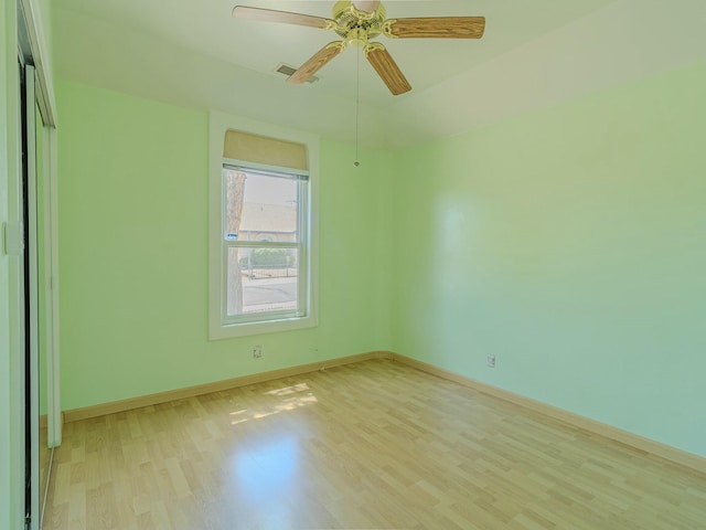 7417 Maplewood Dr NW, Albuquerque, NM 87120 - spare room featuring light wood-type flooring, visible vents, a ceiling fan, and baseboards