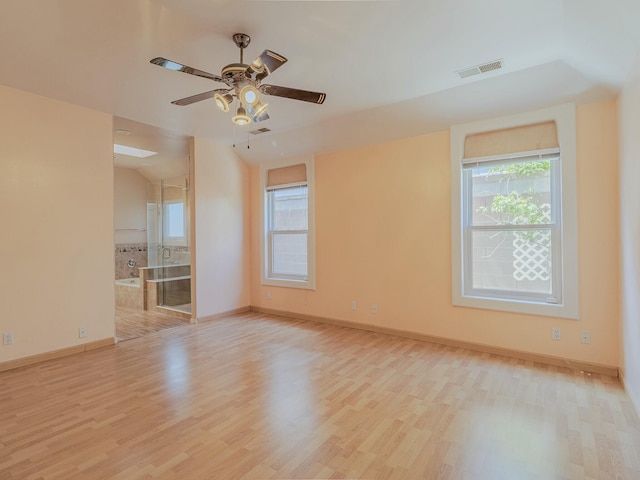 7417 Maplewood Dr NW, Albuquerque, NM 87120 - spare room with wood finished floors, visible vents, baseboards, and ceiling fan