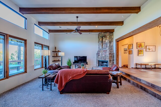 6 Storyteller Ct, Sandia Park, NM 87047 - carpeted living room with a fireplace, ceiling fan, and beamed ceiling