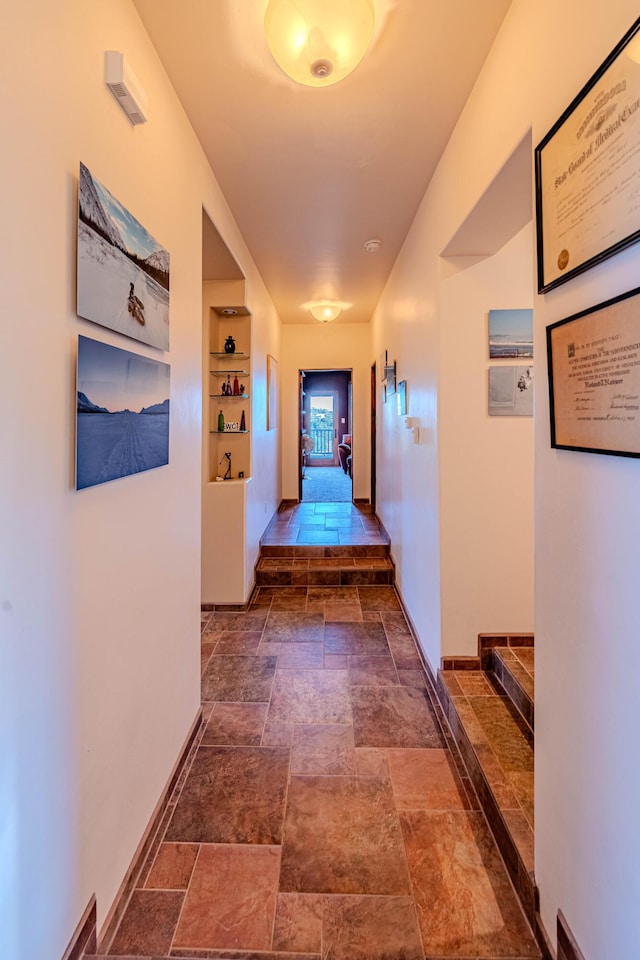 6 Storyteller Ct, Sandia Park, NM 87047 - hallway featuring stone tile flooring and built in features
