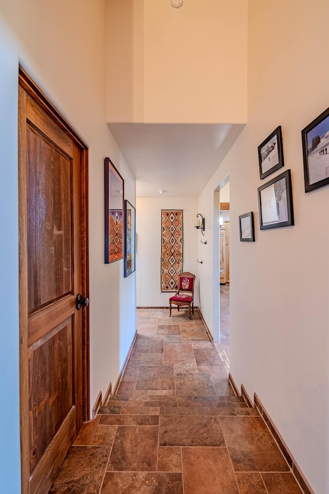6 Storyteller Ct, Sandia Park, NM 87047 - hall with stone tile flooring and baseboards