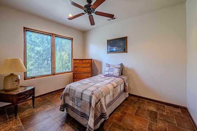 6 Storyteller Ct, Sandia Park, NM 87047 - bedroom with stone tile floors, ceiling fan, and recessed lighting