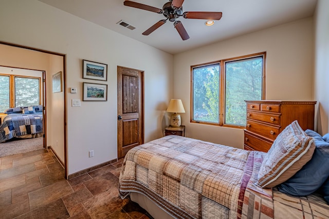 6 Storyteller Ct, Sandia Park, NM 87047 - bedroom with dark stone finish flooring, a ceiling fan, and recessed lighting