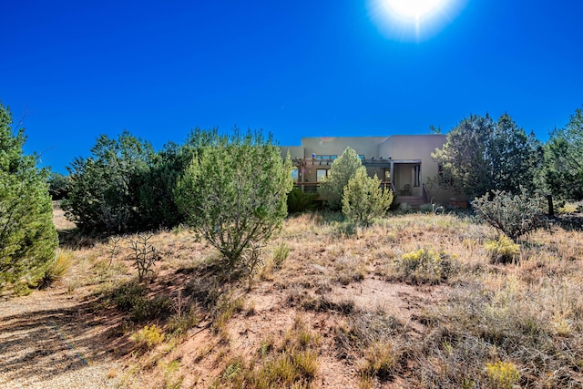 6 Storyteller Ct, Sandia Park, NM 87047 - exterior space featuring stucco siding
