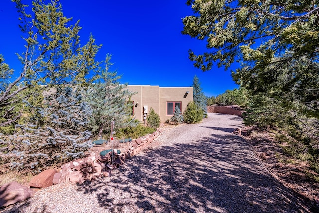 6 Storyteller Ct, Sandia Park, NM 87047 - view of front of home with stucco siding