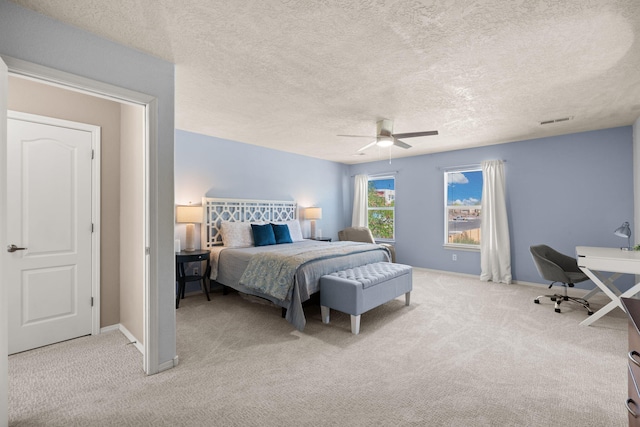 4201 High Mesa Rd SE, Rio Rancho, NM 87124 - bedroom with light carpet, baseboards, ceiling fan, a textured ceiling, and an office area