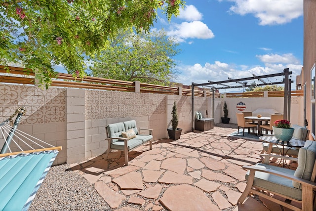 4201 High Mesa Rd SE, Rio Rancho, NM 87124 - view of patio featuring outdoor dining space and a fenced backyard