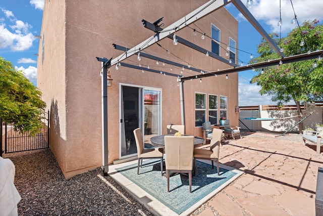 4201 High Mesa Rd SE, Rio Rancho, NM 87124 - view of patio with a pergola, fence, and outdoor dining area