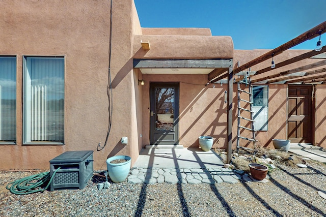exterior space with stucco siding
