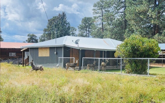 back of property with fence