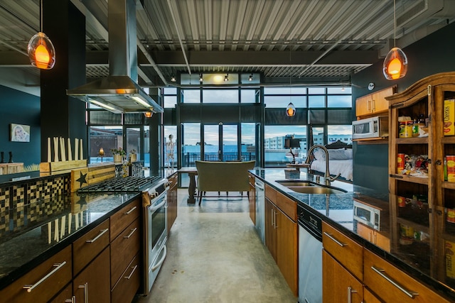 100 Gold Ave SW Unit 404, Albuquerque, NM 87102 - kitchen with island exhaust hood, concrete flooring, stainless steel appliances, decorative light fixtures, and dark stone counters