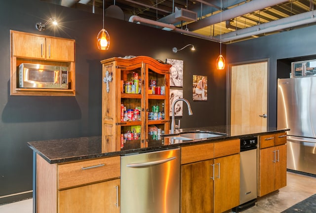 100 Gold Ave SW Unit 404, Albuquerque, NM 87102 - kitchen featuring appliances with stainless steel finishes, dark stone countertops, concrete flooring, and pendant lighting