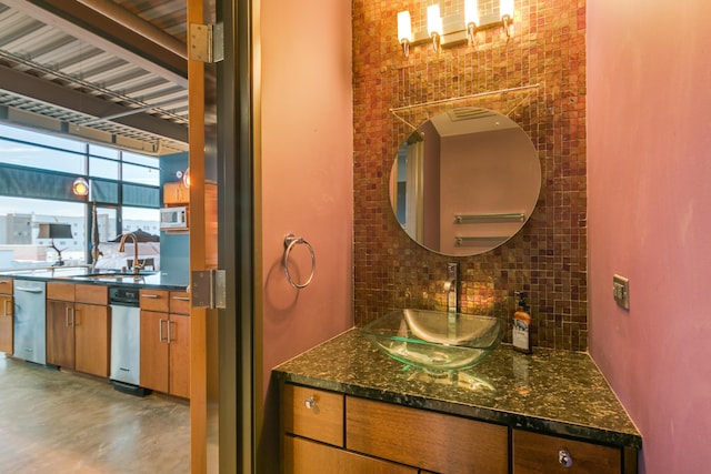 100 Gold Ave SW Unit 404, Albuquerque, NM 87102 - bathroom with decorative backsplash and vanity