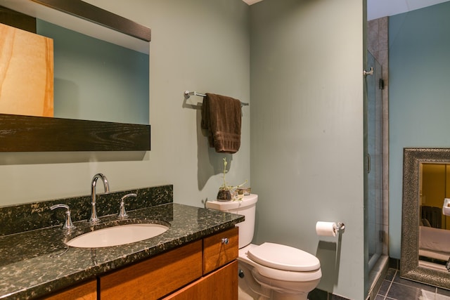 100 Gold Ave SW Unit 404, Albuquerque, NM 87102 - bathroom with a shower stall, tile patterned flooring, and vanity