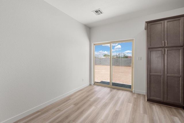 2507 Calle Del Los Claveles, Belen, NM 87002 - unfurnished dining area with light wood finished floors and baseboards