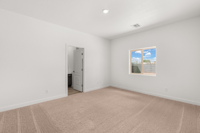 2507 Calle Del Los Claveles, Belen, NM 87002 - spare room with light carpet, baseboards, and recessed lighting