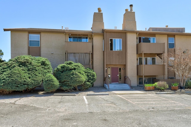 3829 Montgomery Blvd NE Unit 301, Albuquerque, NM 87109 - view of building exterior featuring uncovered parking
