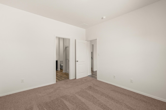 interior space with carpet floors and baseboards