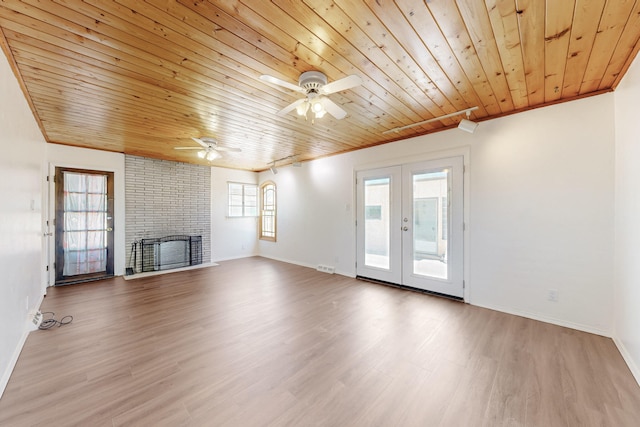 unfurnished living room with wood finished floors, wooden ceiling, ceiling fan, and french doors