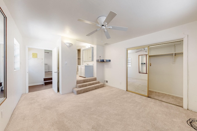 unfurnished bedroom featuring a closet, ceiling fan, carpet, ensuite bath, and visible vents