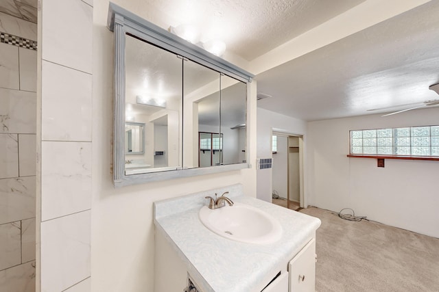 bathroom featuring vanity and ceiling fan